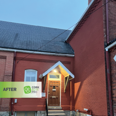 A Reinvigorated And Inviting Brick House With Wooden Door After Application Of Cork Elite Pro Cork Spray.