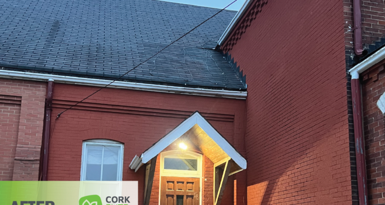 A reinvigorated and inviting brick house with wooden door after application of Cork Elite Pro cork spray.