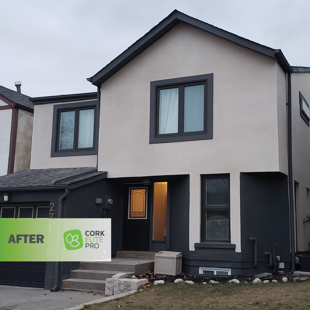 A freshly renovated house featuring new windows, showcasing a vibrant and updated exterior finished with Cork Elite Pro for enhanced durability and insulation.